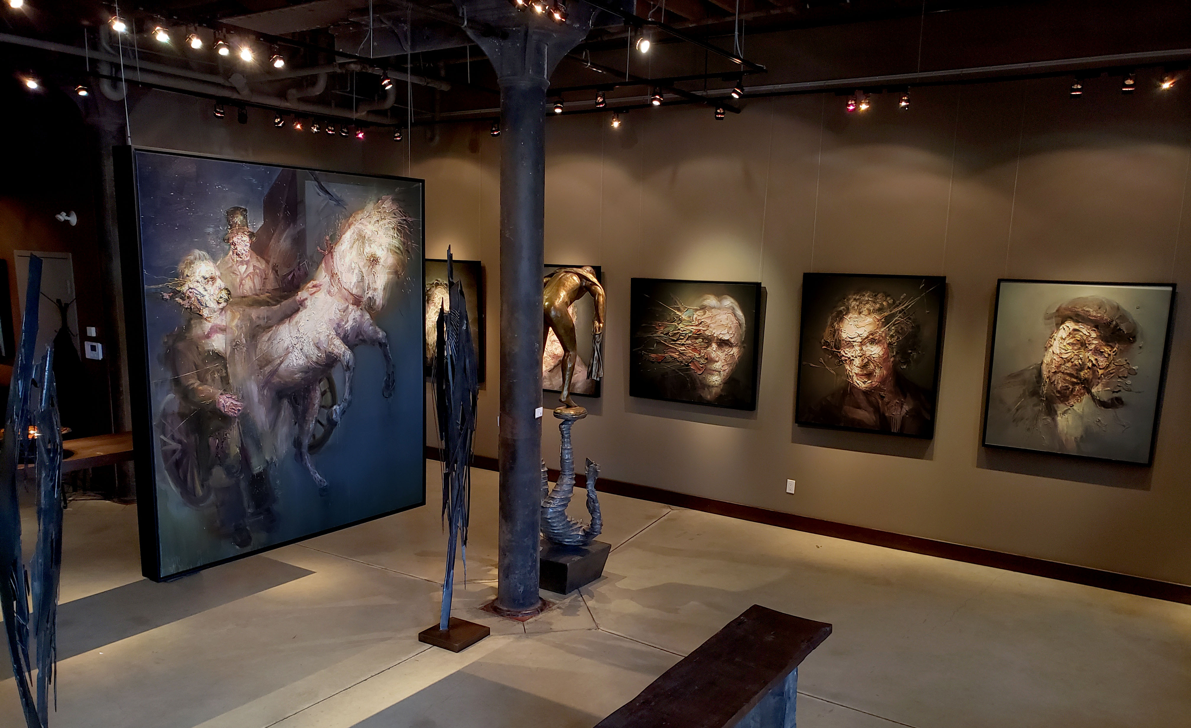 The Turin horse painting and a selection of other Laca originals hanging in the Thompson Landry Gallery